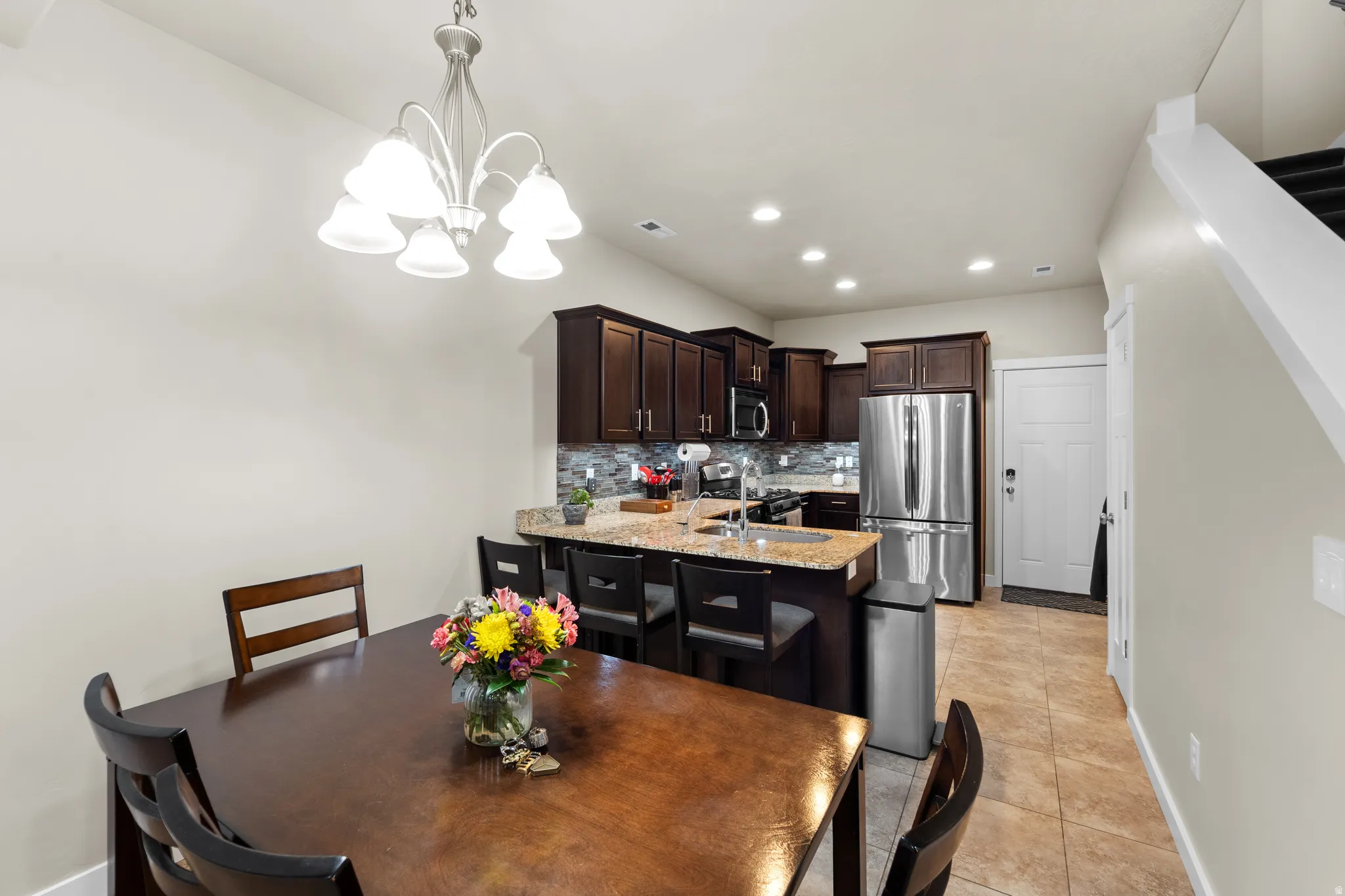 The living flows perfectly into the dining area but still has enough separation to give it it's own identity.