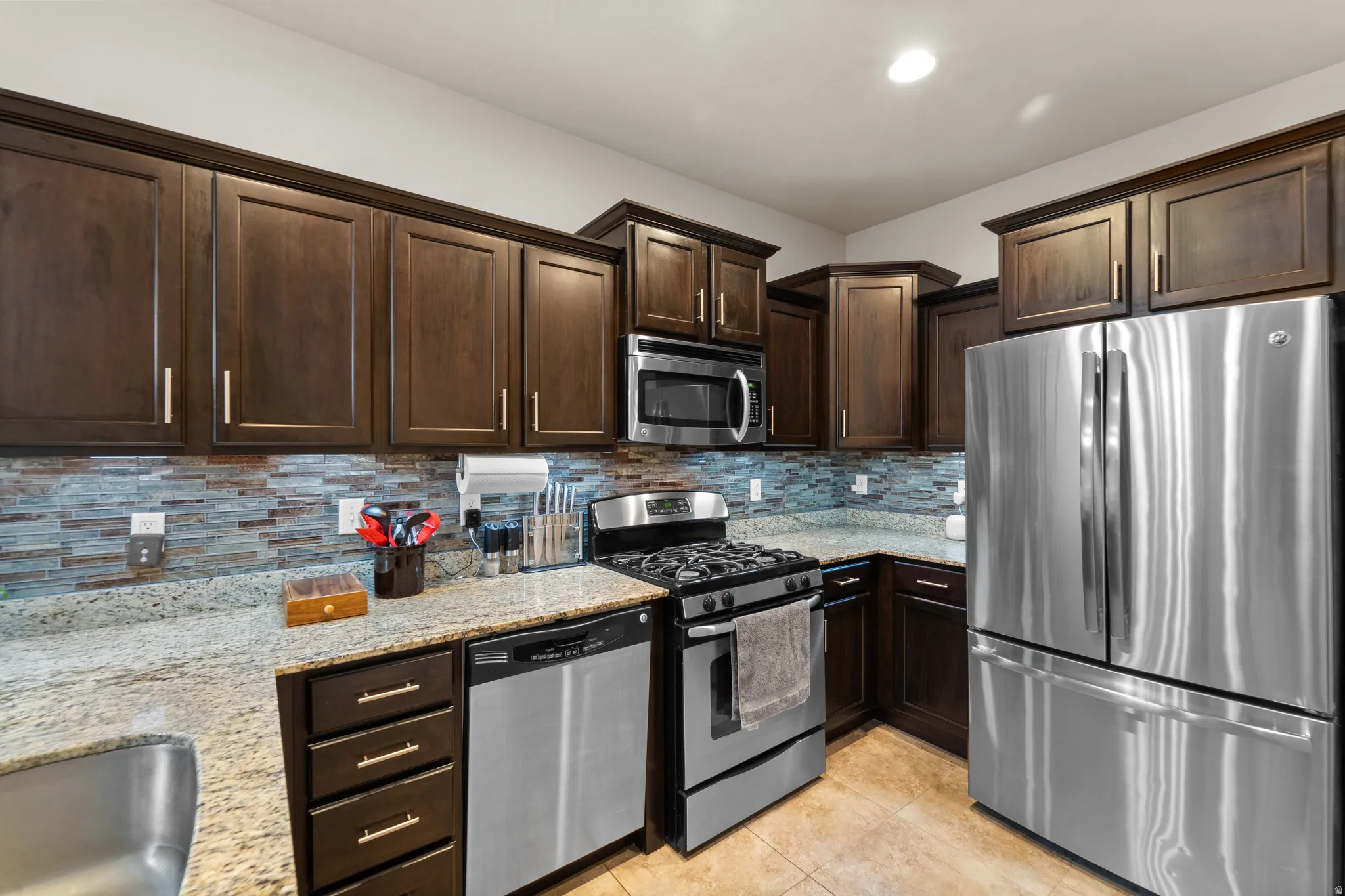 Staggered cabinets with varying heights and depths creates striking focal points and adds luxurious architectural dimension.