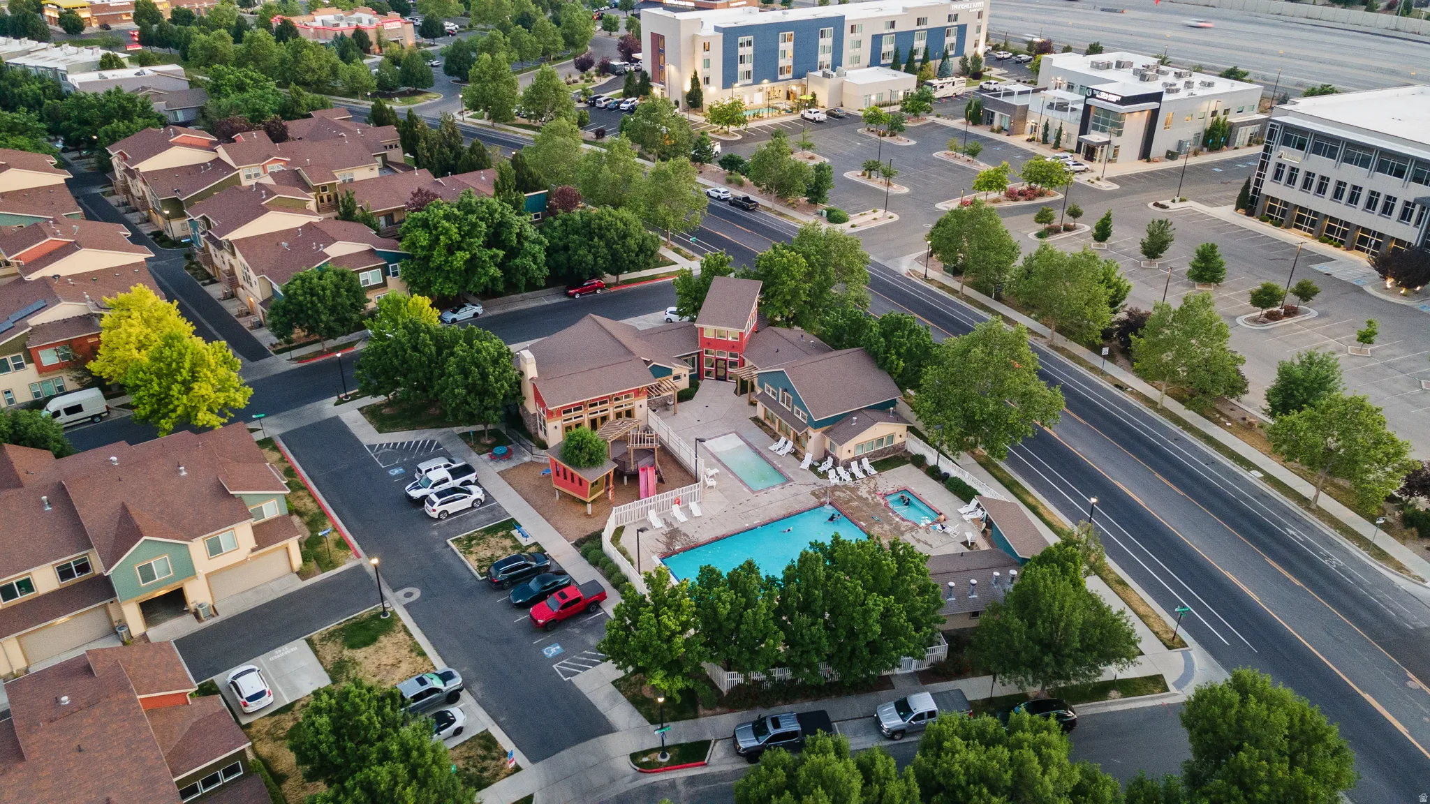 The main play set matches the design of the community. The clubhouse has two swimming pools one for small kids to safly play and the larger pool for groups.