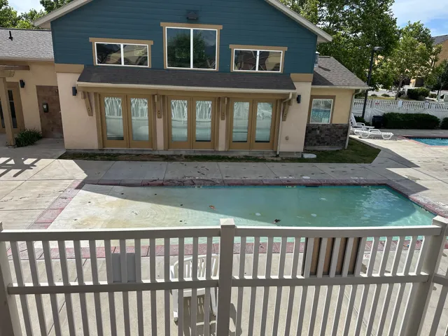 Community pool with surrounding concrete decking