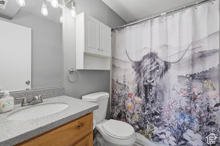Bathroom vanity with a light-toned countertop and an undermount sink