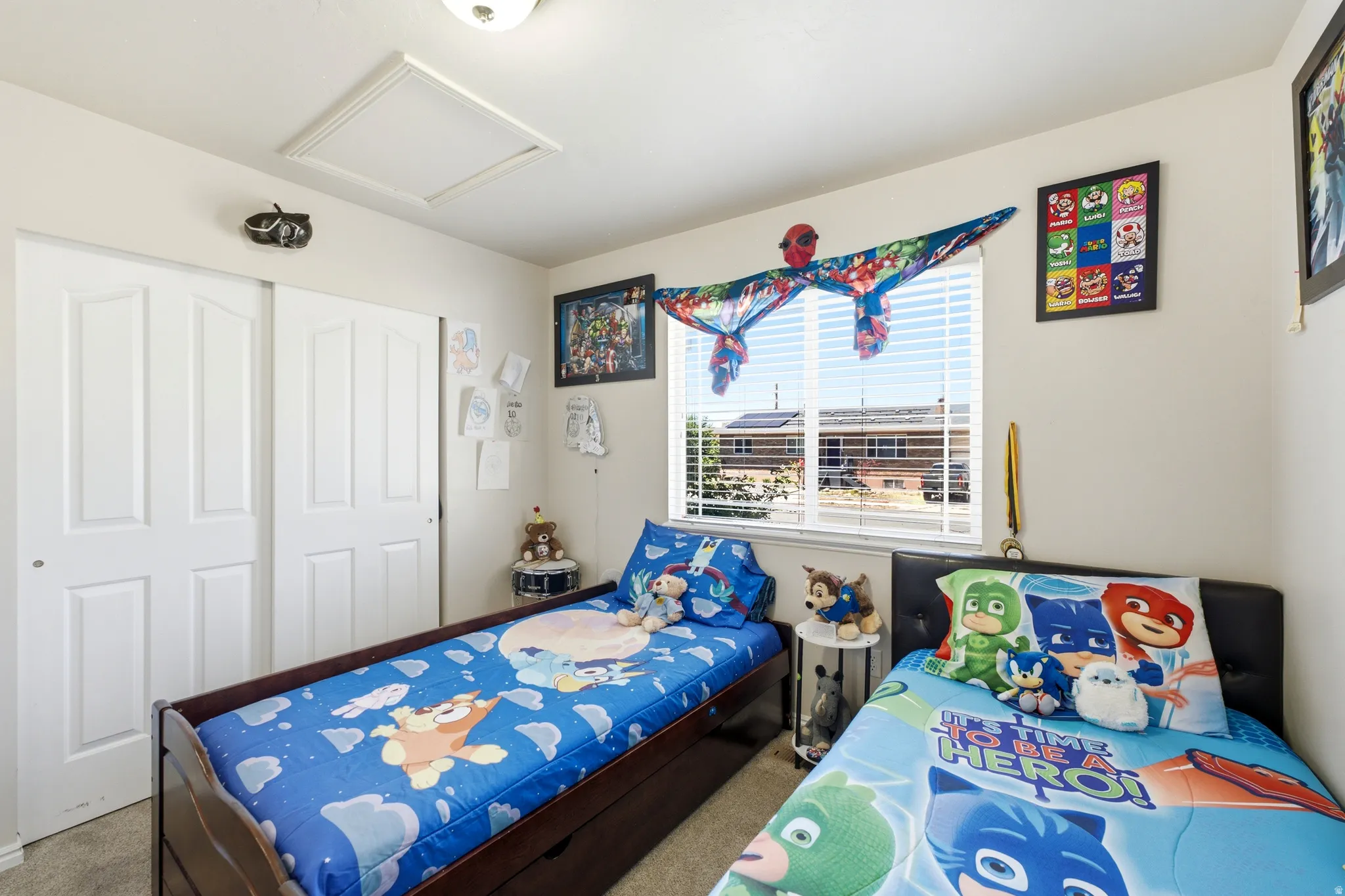 Room featuring neutral wall paint, a window with horizontal blinds, and a ceiling light fixture