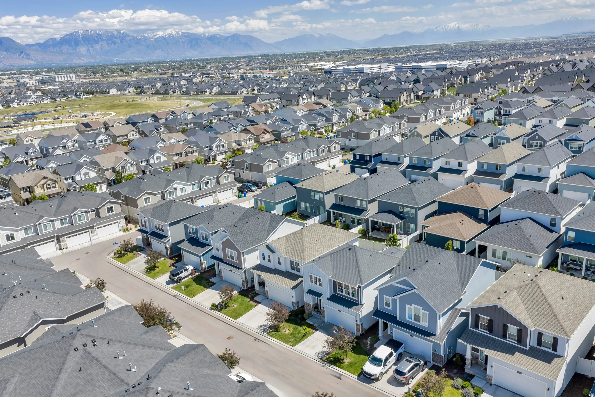 Aerial perspective showcasing a developed residential neighborhood with uniform housing styles