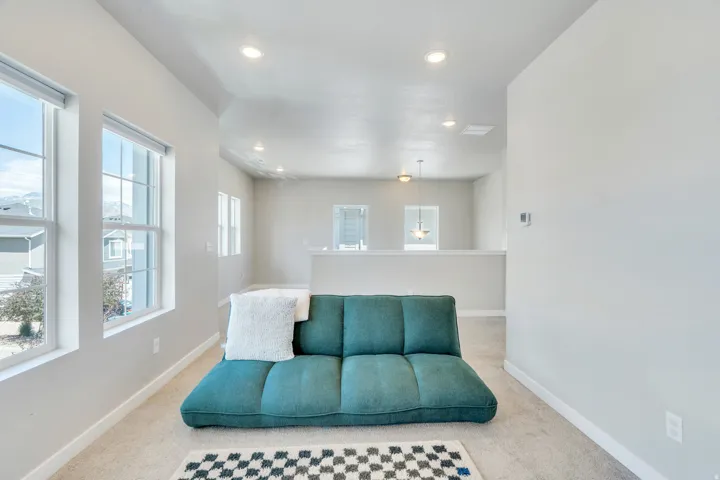 Open room featuring carpet flooring and light-toned walls