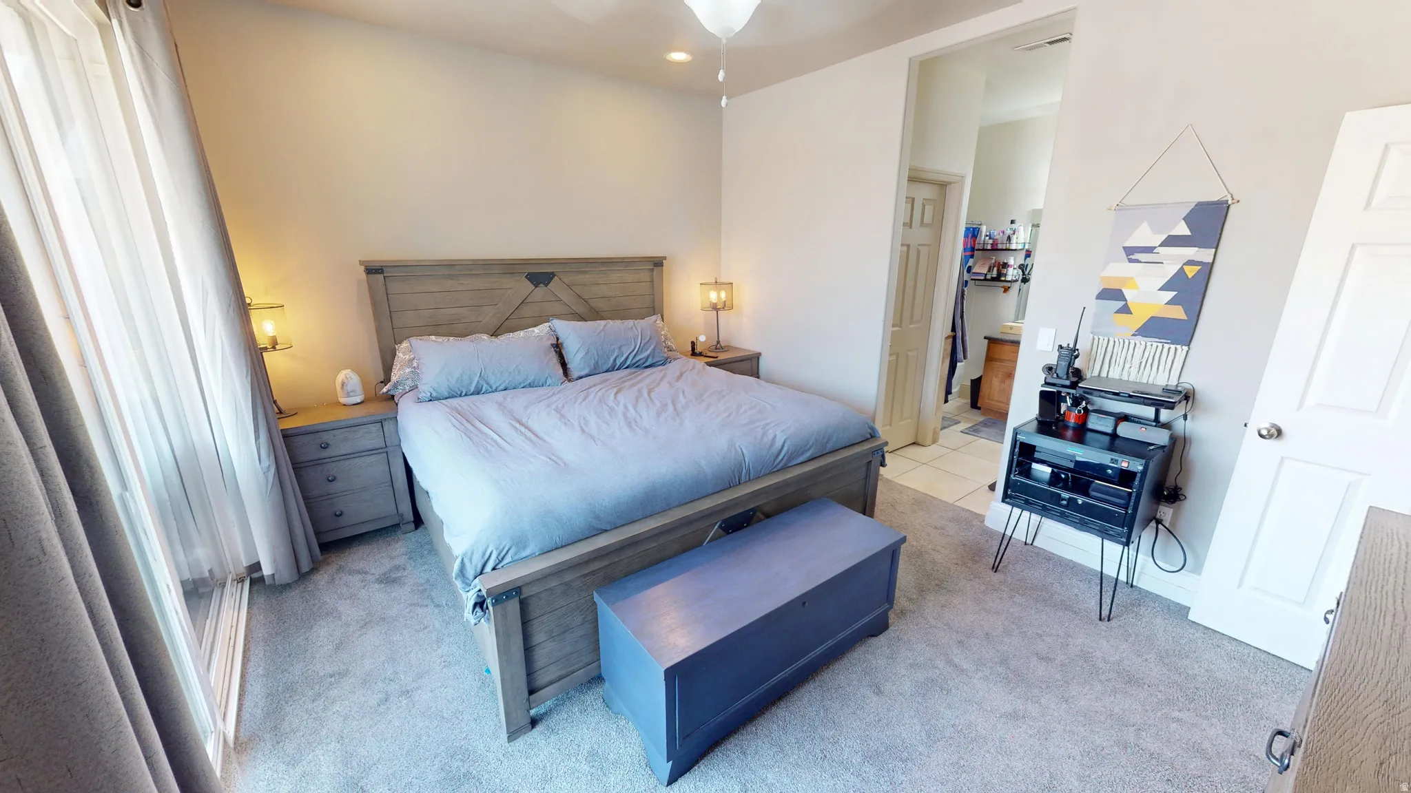 Light-colored walls and soft gray carpeting create a neutral interior
