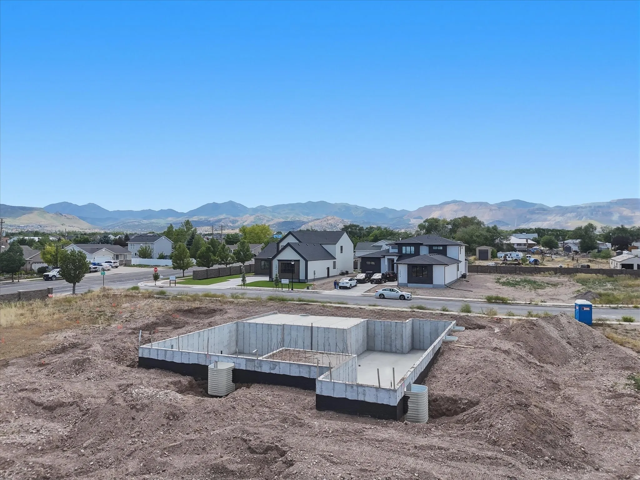 Concrete foundation with a surrounding dirt lot