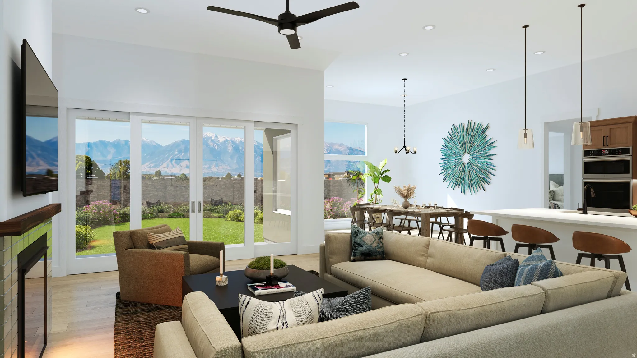 Open-concept interior featuring light wood-finish flooring, a contemporary ceiling fan, and recessed lighting