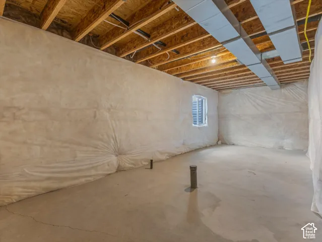 Concrete flooring with exposed ceiling joists and ductwork
