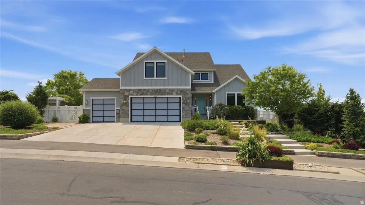 Contemporary exterior with board and batten siding and stone accents