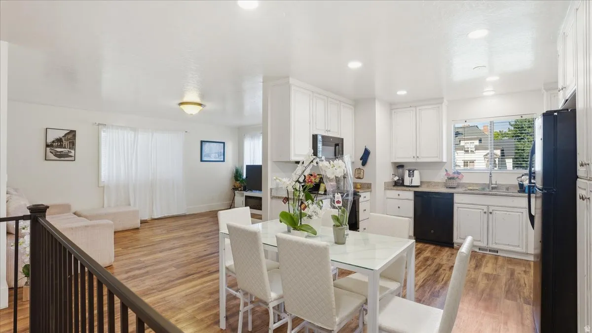 Open-concept living space with wood-finish flooring