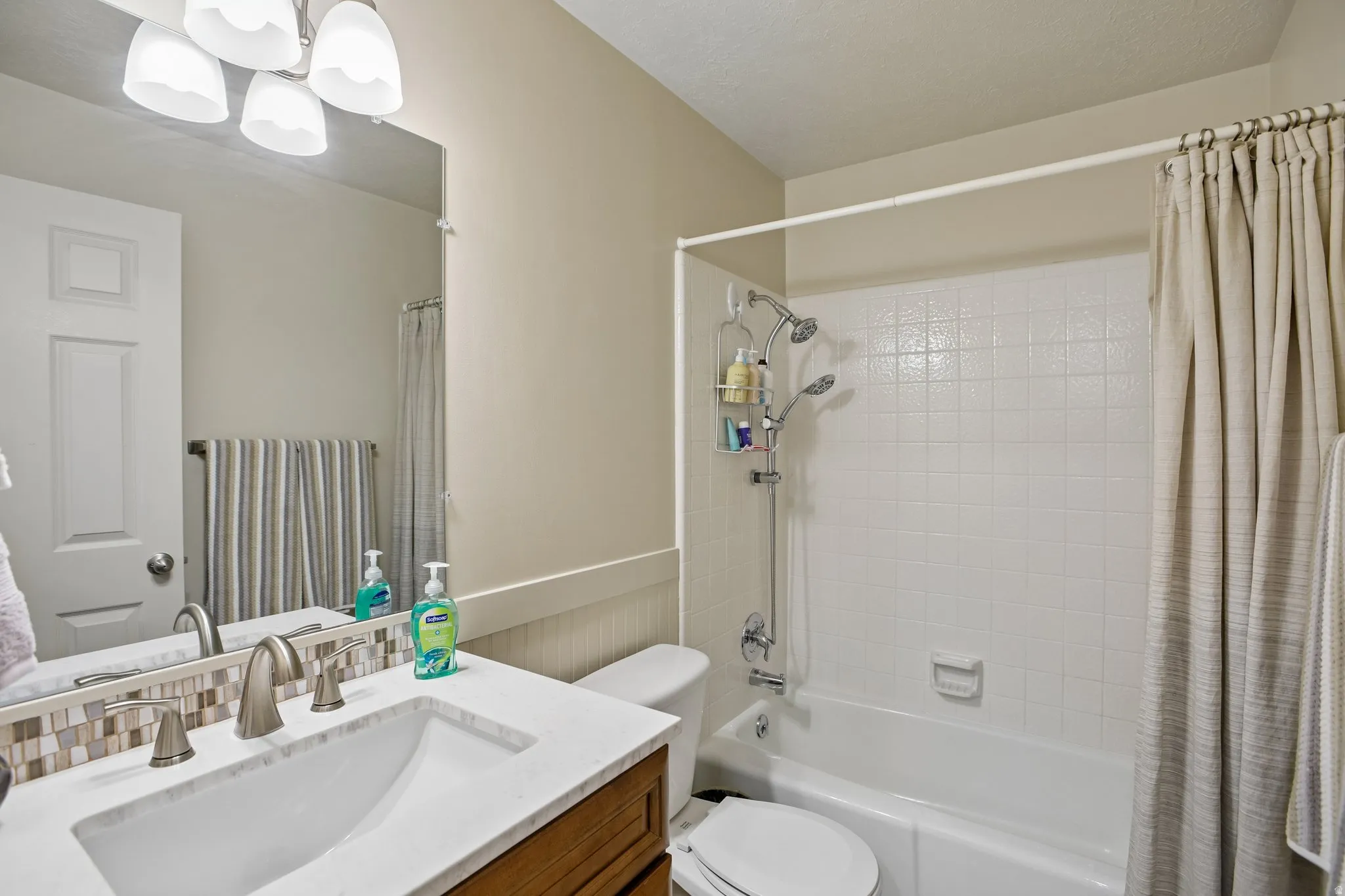 Bathroom vanity with a white countertop and undermount sink