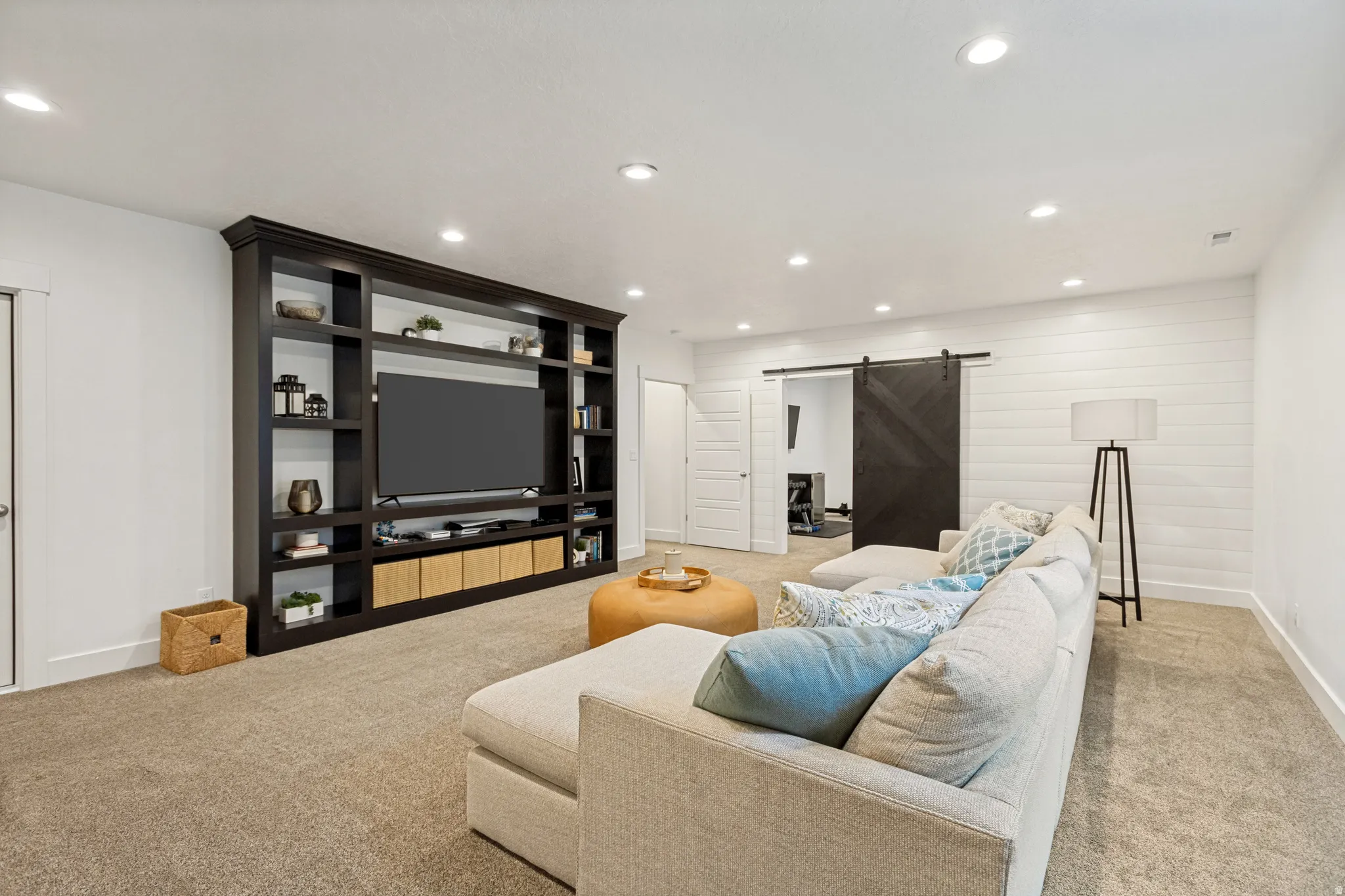 Integrated custom built-in media cabinetry with extensive shelving