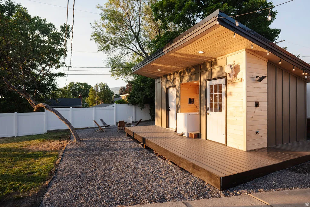 Modern detached structure with a wood-finish exterior and a sloped roofline
