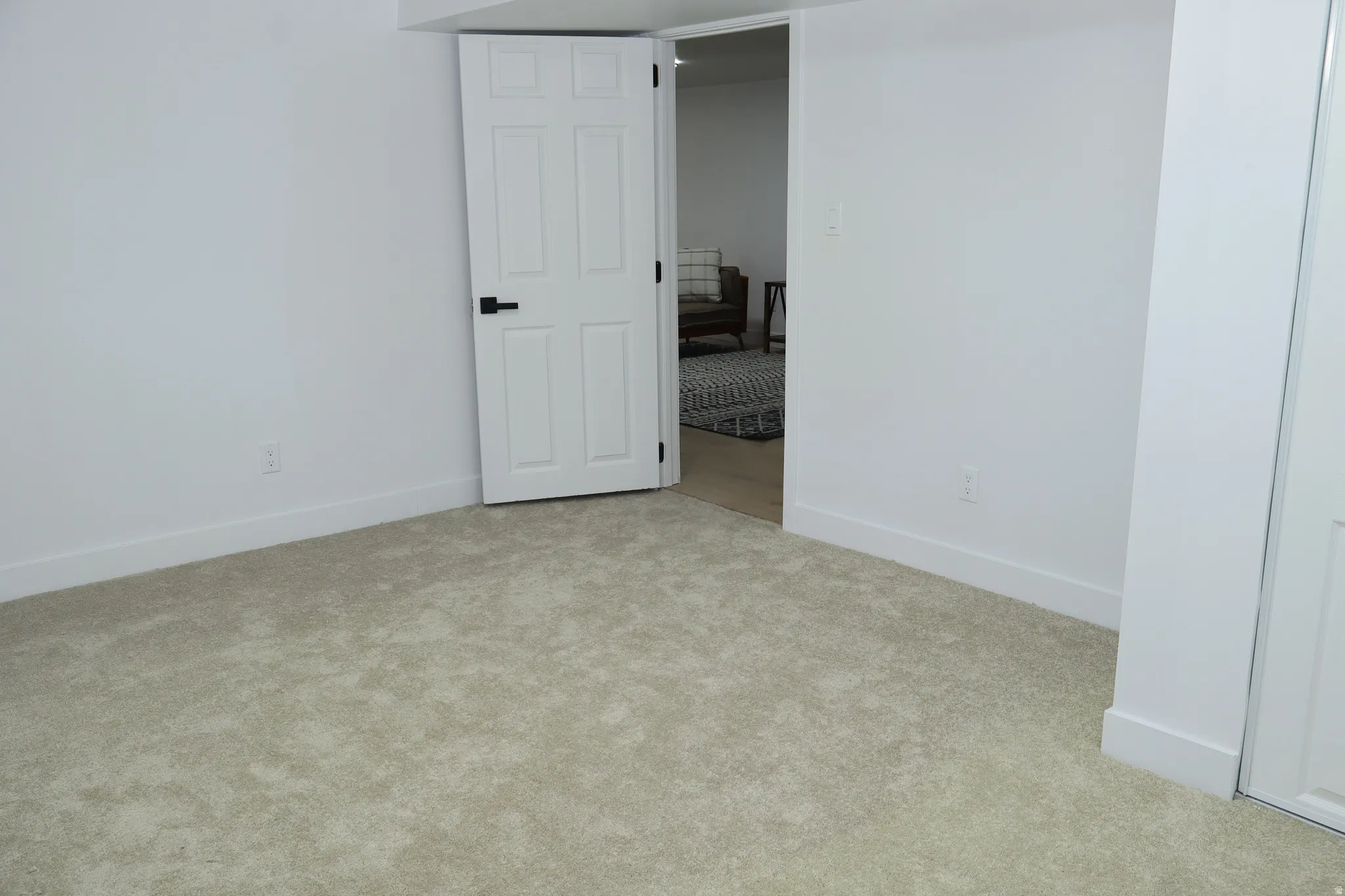 Textured carpet flooring complementing crisp white walls