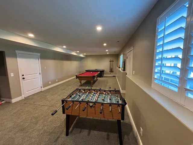 Spacious lower level featuring recessed lighting, neutral wall tones, and plush carpet flooring