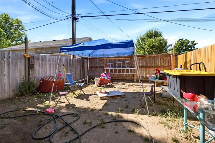 Fenced backyard with wood privacy fencing