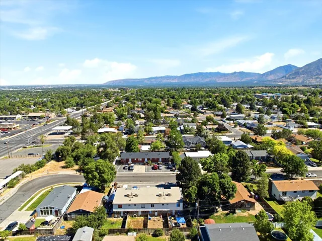 Expansive aerial perspective showcasing a residential area with mature tree coverage