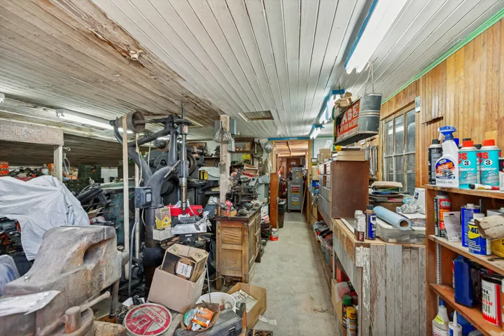 Workshop space featuring wood-paneled walls and a slatted wood ceiling