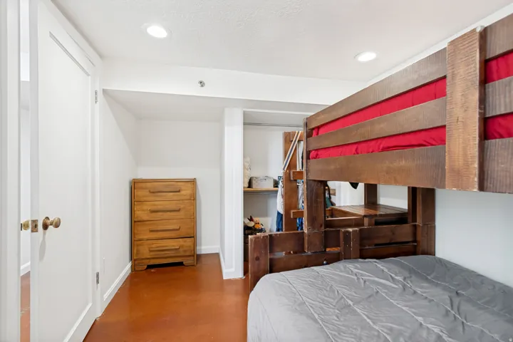Built-in wooden bunk bed with integrated shelving
