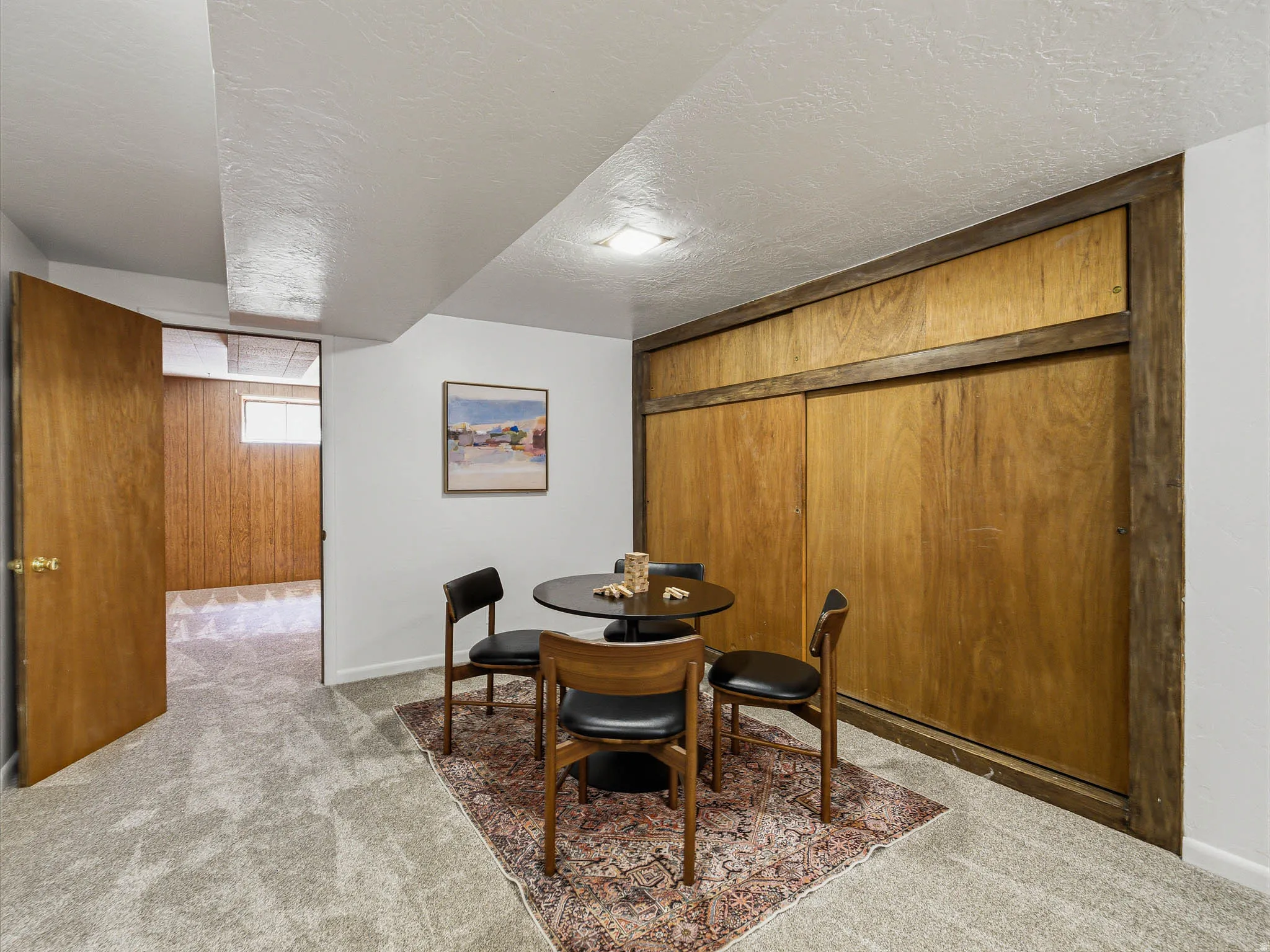 Room featuring light gray carpet, white walls, and a recessed ceiling light