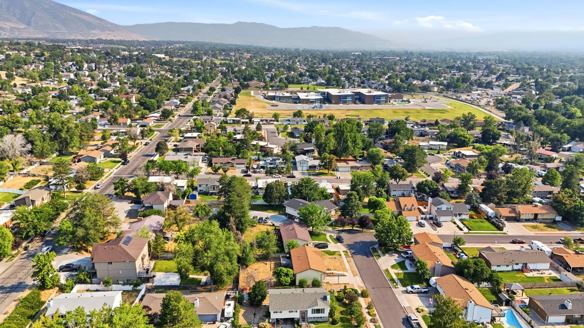 Expansive aerial perspective showcasing a residential neighborhood with a variety of home styles