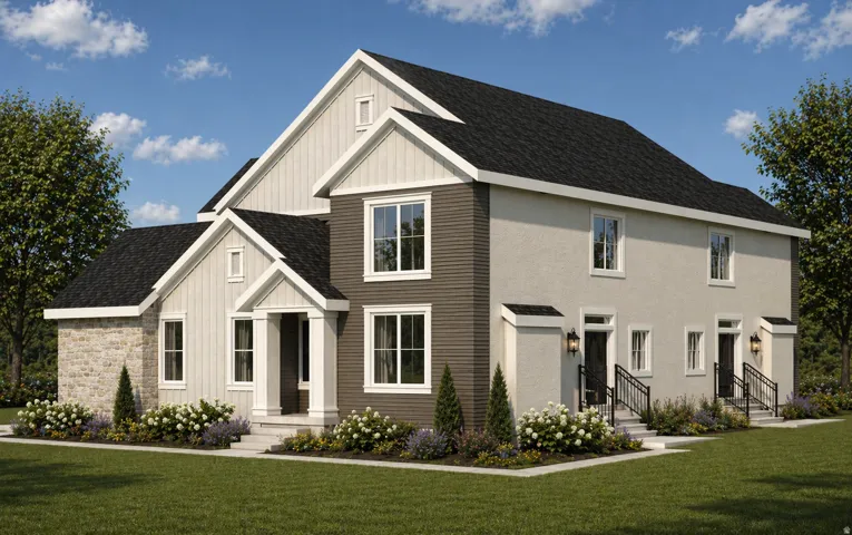 Multi-level residence featuring a dark asphalt shingle roof and a combination of light stone veneer, vertical board-and-batten siding, horizontal siding, and stucco finishes