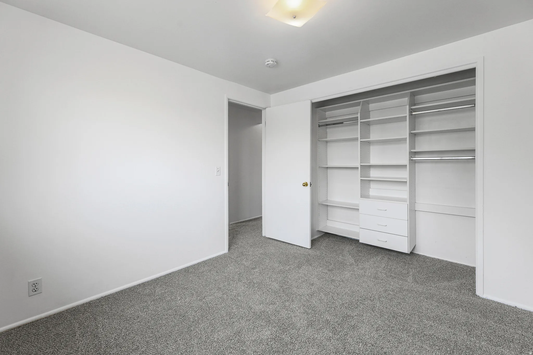 Bedroom #2 - New carpet, paint and custom build in shelving.