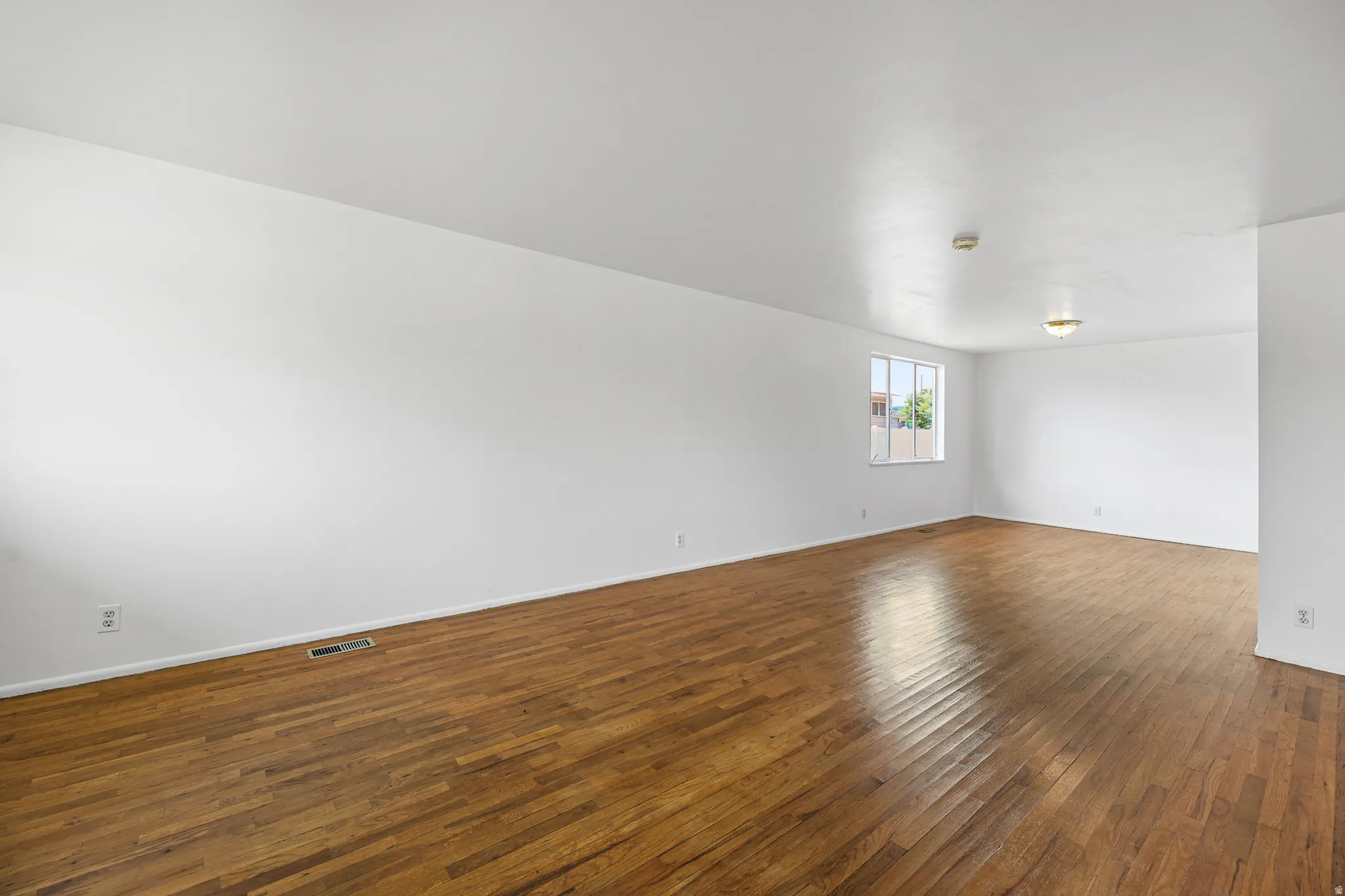 Living room - Original flooring - recently stained. New paint.