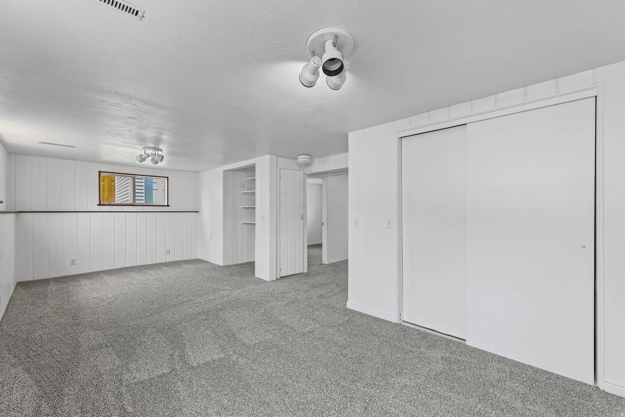 Newly painted basement large rec room.