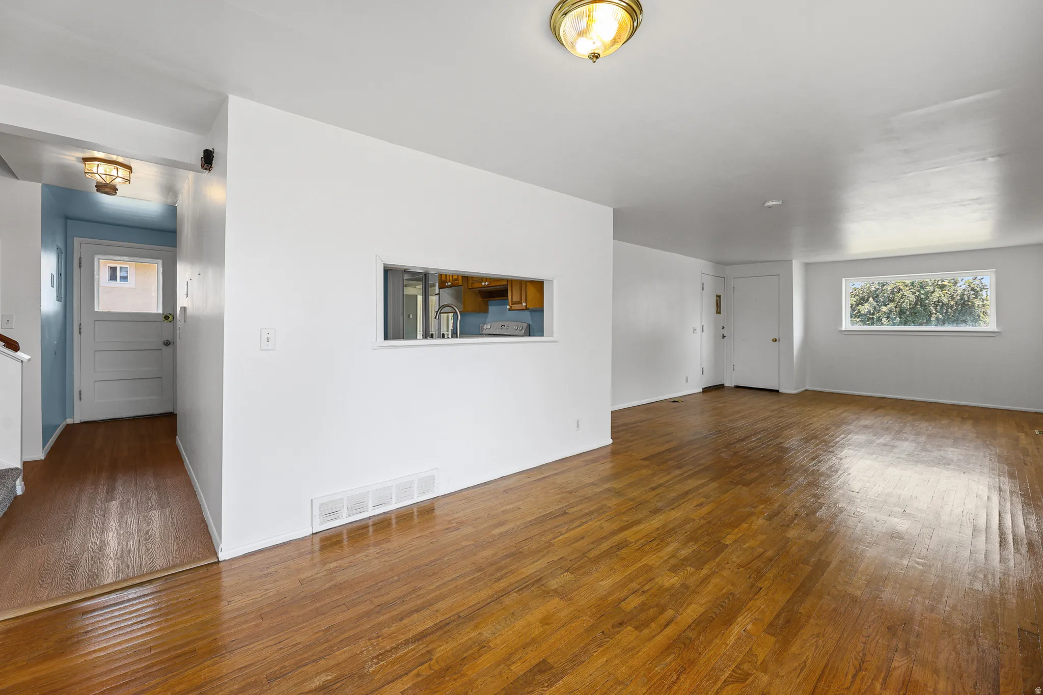 Living room - Original flooring - recently stained. New paint.