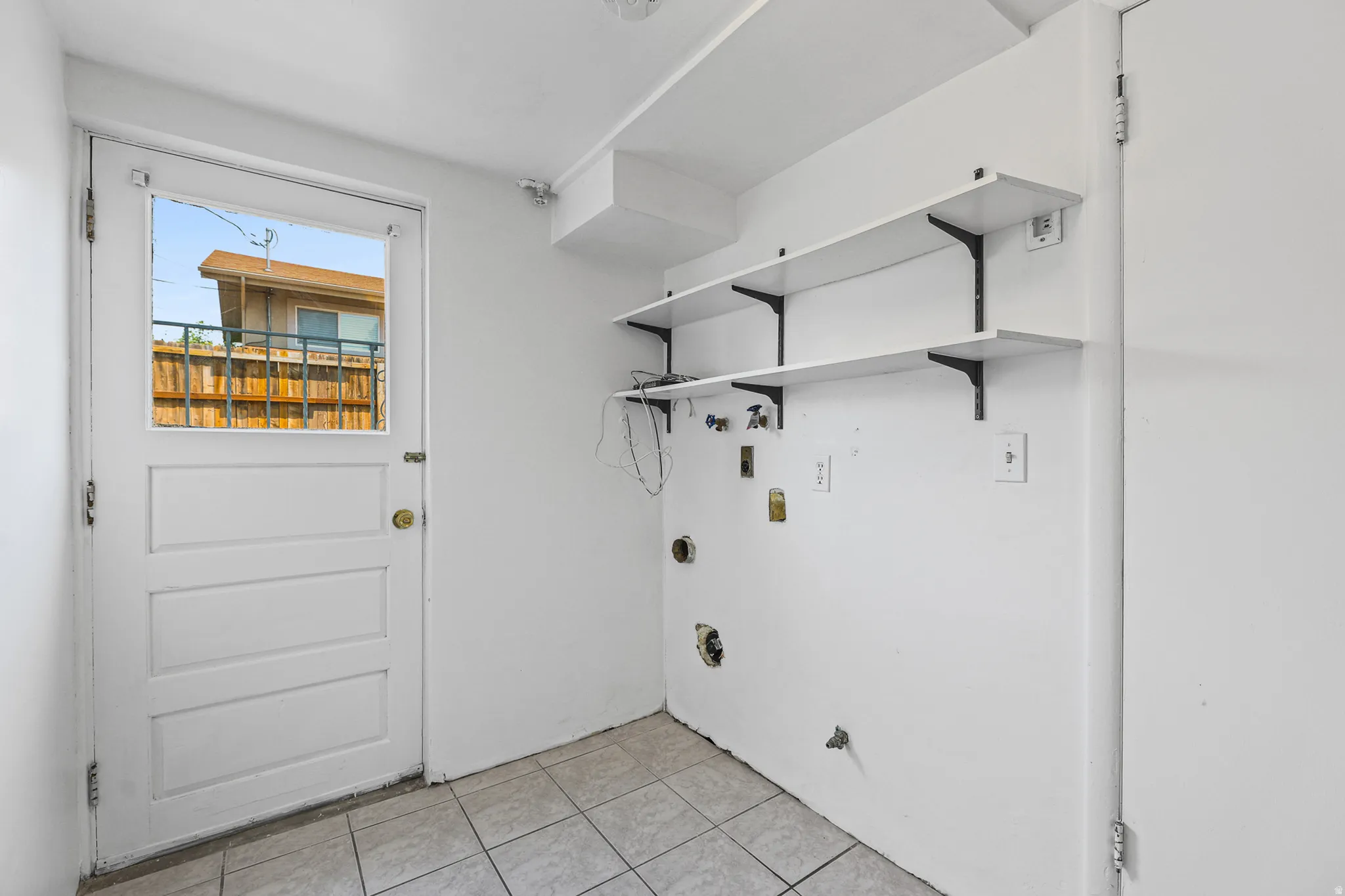 Laundry area and exterior door.