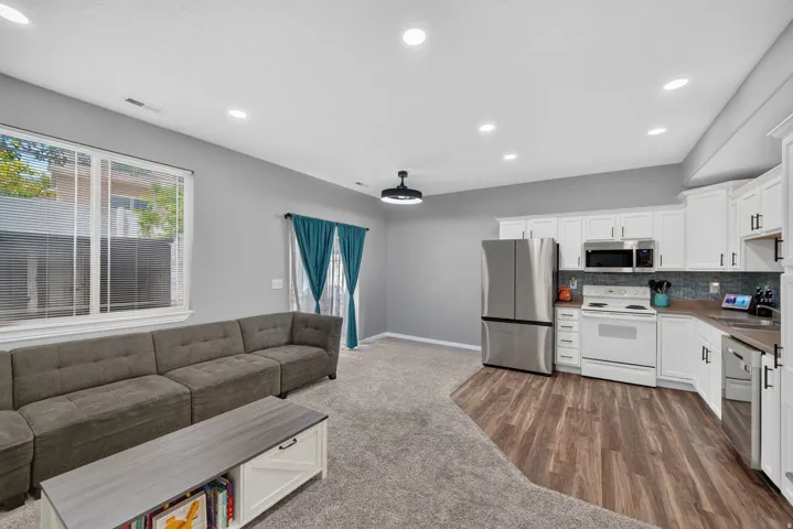 Open-concept living space featuring recessed lighting and a ceiling-mounted light fixture