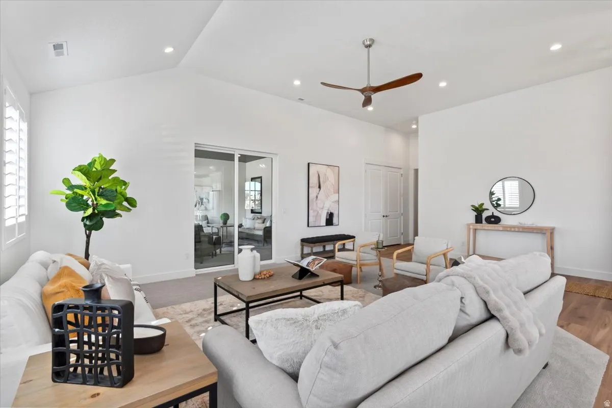 Vaulted ceilings featuring recessed lighting and a contemporary ceiling fan