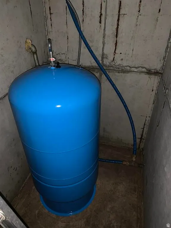 Blue pressure tank with integrated plumbing connections