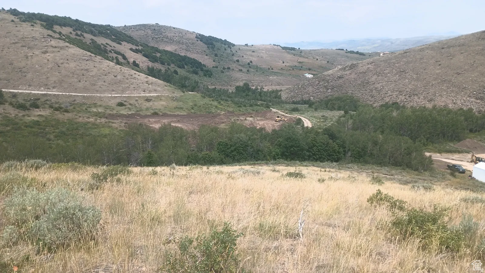 Expansive sloped terrain with natural foliage