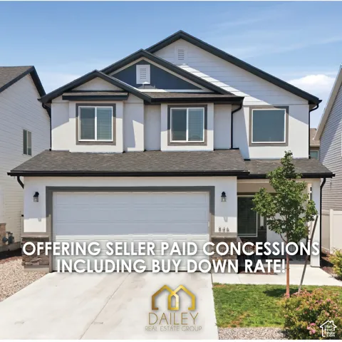 Two-story exterior featuring a mix of horizontal siding and smooth stucco finish, stone veneer accents, multi-gabled roofline, and an attached two-car garage