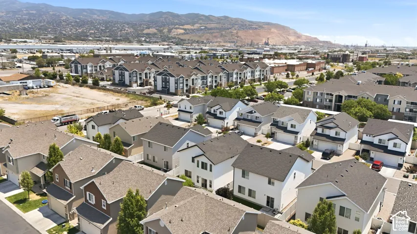Residential neighborhood featuring a mix of single-family homes and multi-story apartment buildings