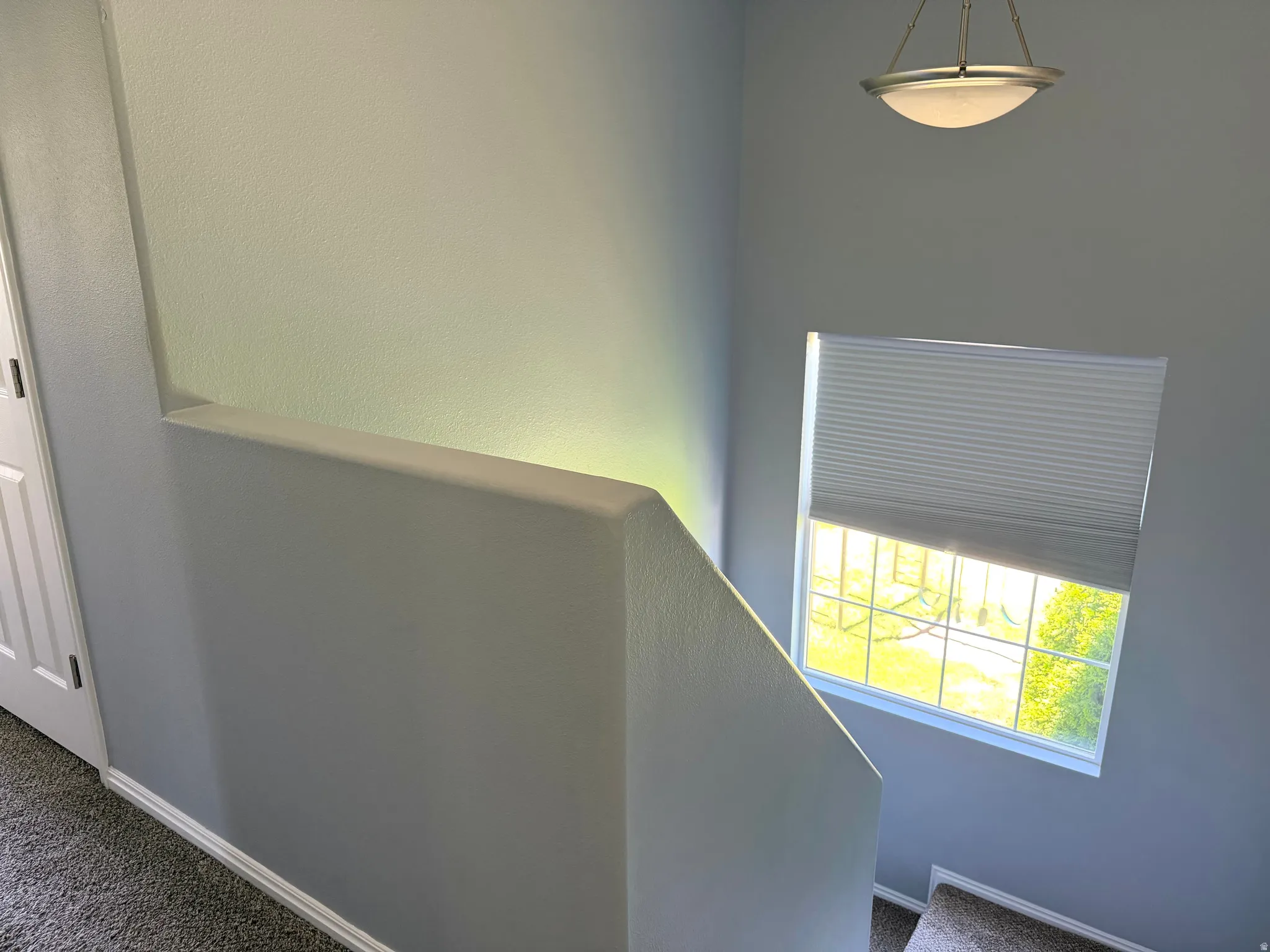 Window with horizontal muntins and cellular shade