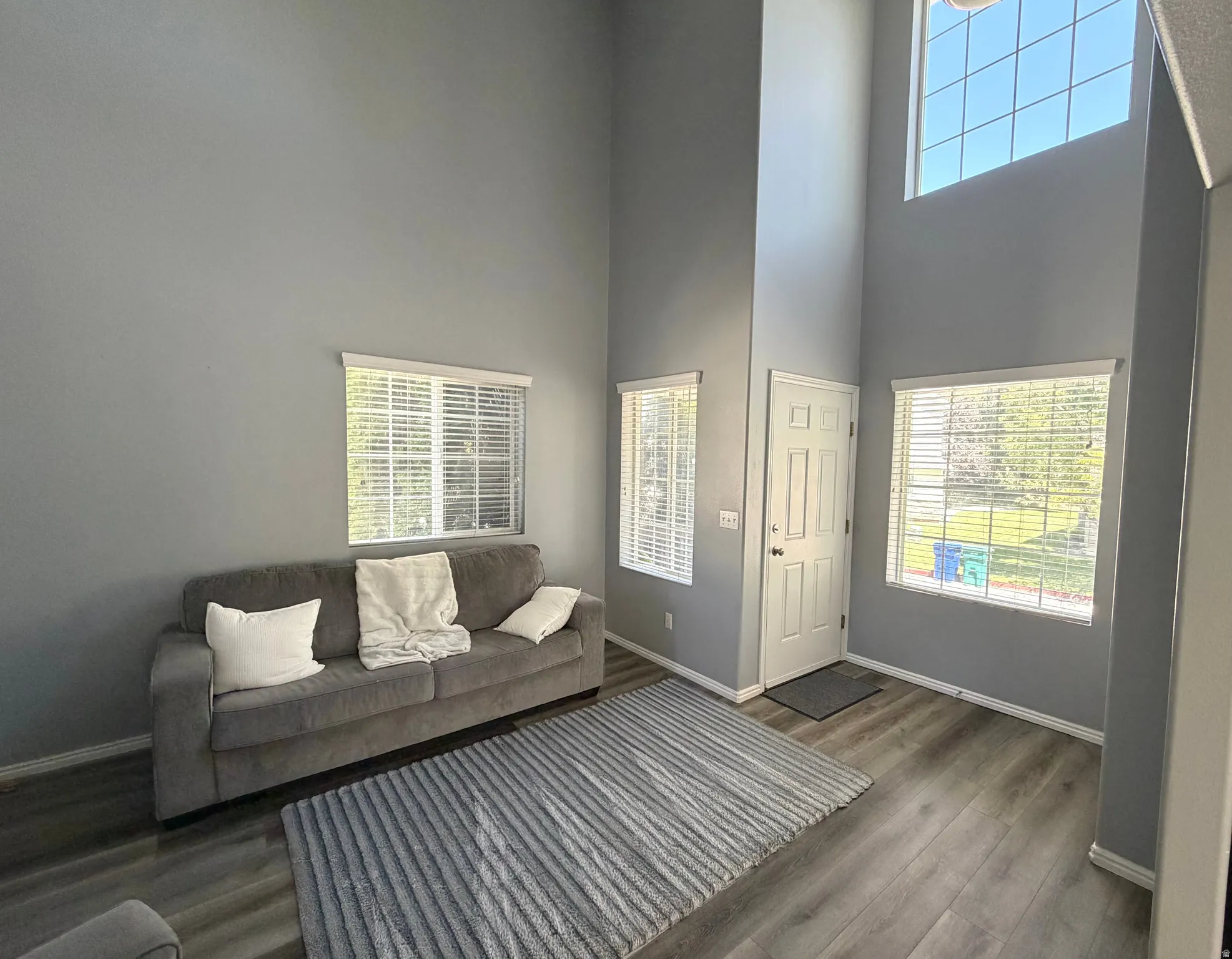 Vaulted ceilings and abundant natural light highlight this living space