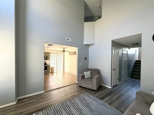 Vaulted ceilings enhance the main living area featuring wood-finish flooring