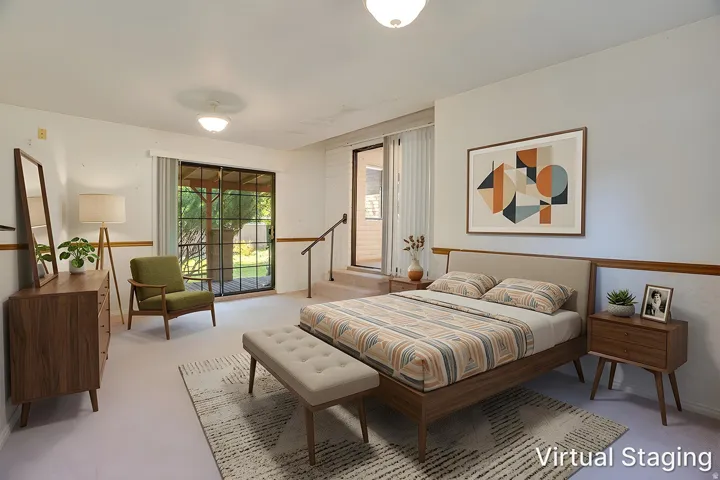 Light-toned carpeting complementing white walls with a wood-finish trim accent