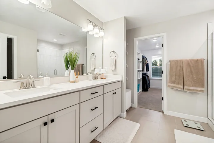Double vanity with light countertops and undermount sinks