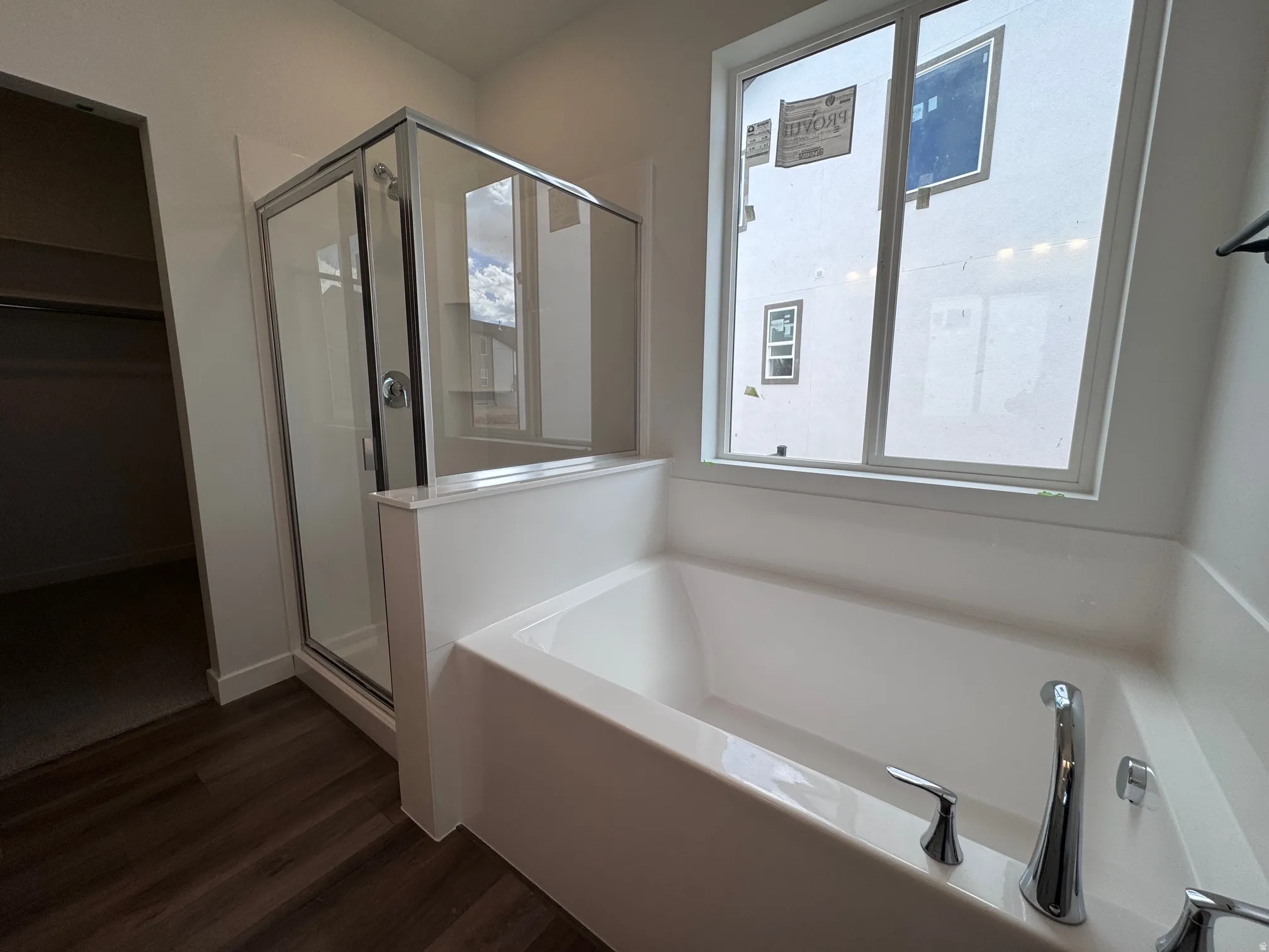 Modern soaking tub with polished chrome fixtures