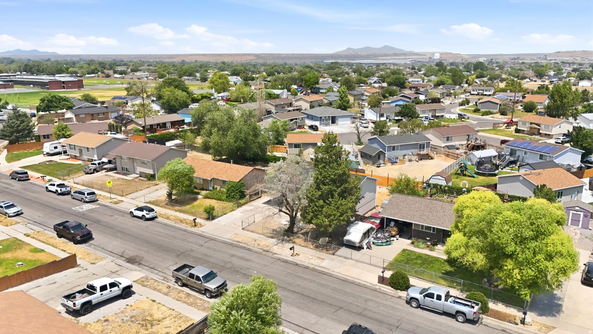 Residential neighborhood featuring various single-family homes with pitched roofs and established landscaping