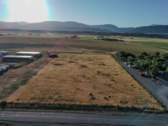 Expansive open land with a backdrop of distant mountains