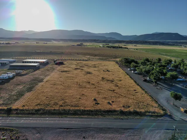 Expansive parcel featuring a large, level field and direct road frontage