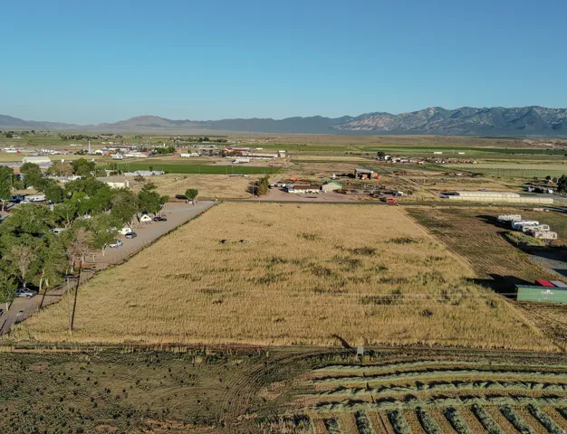 Expansive undeveloped land parcel with surrounding agricultural fields