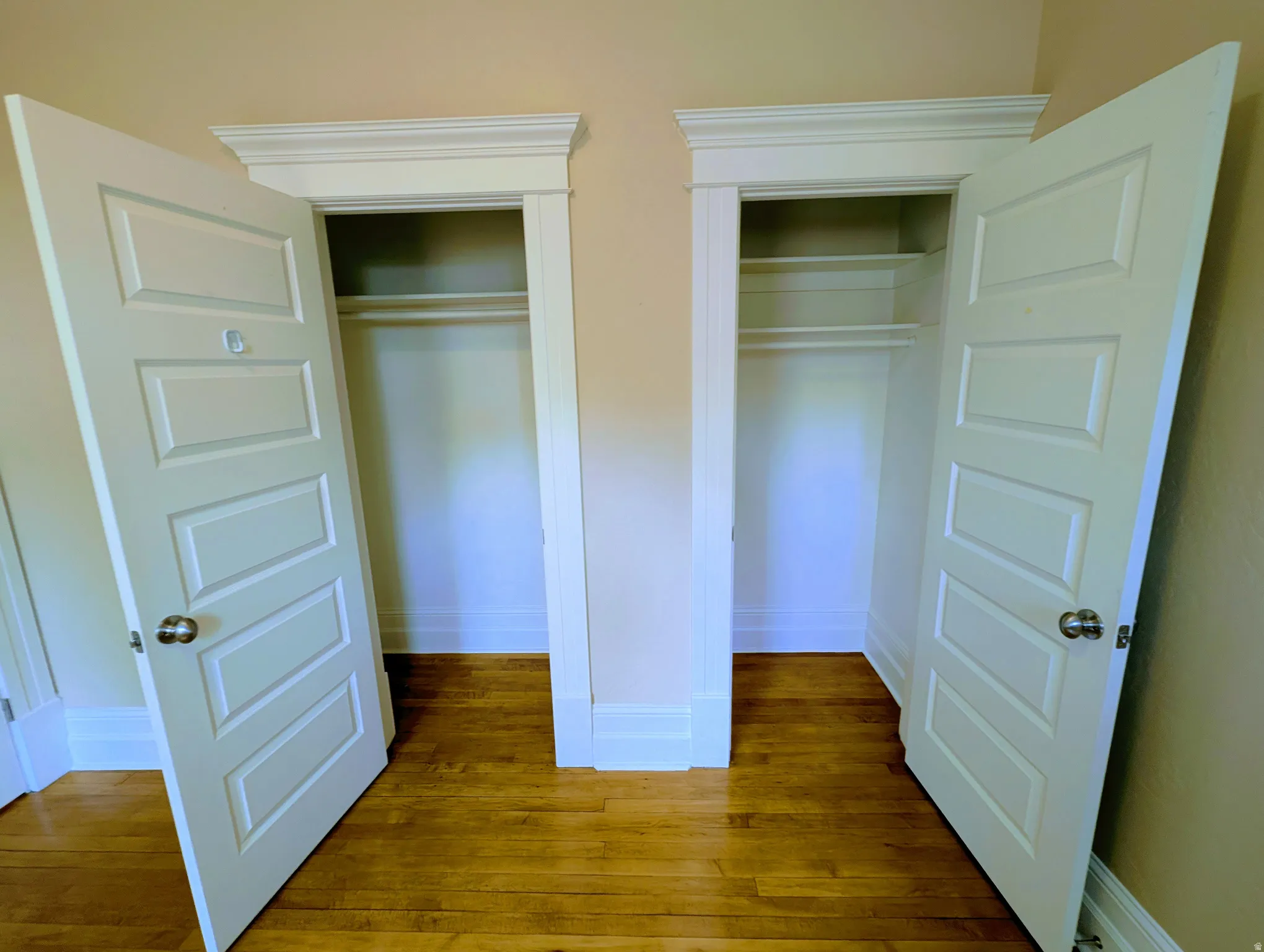 Dual paneled doors opening to built-in closets