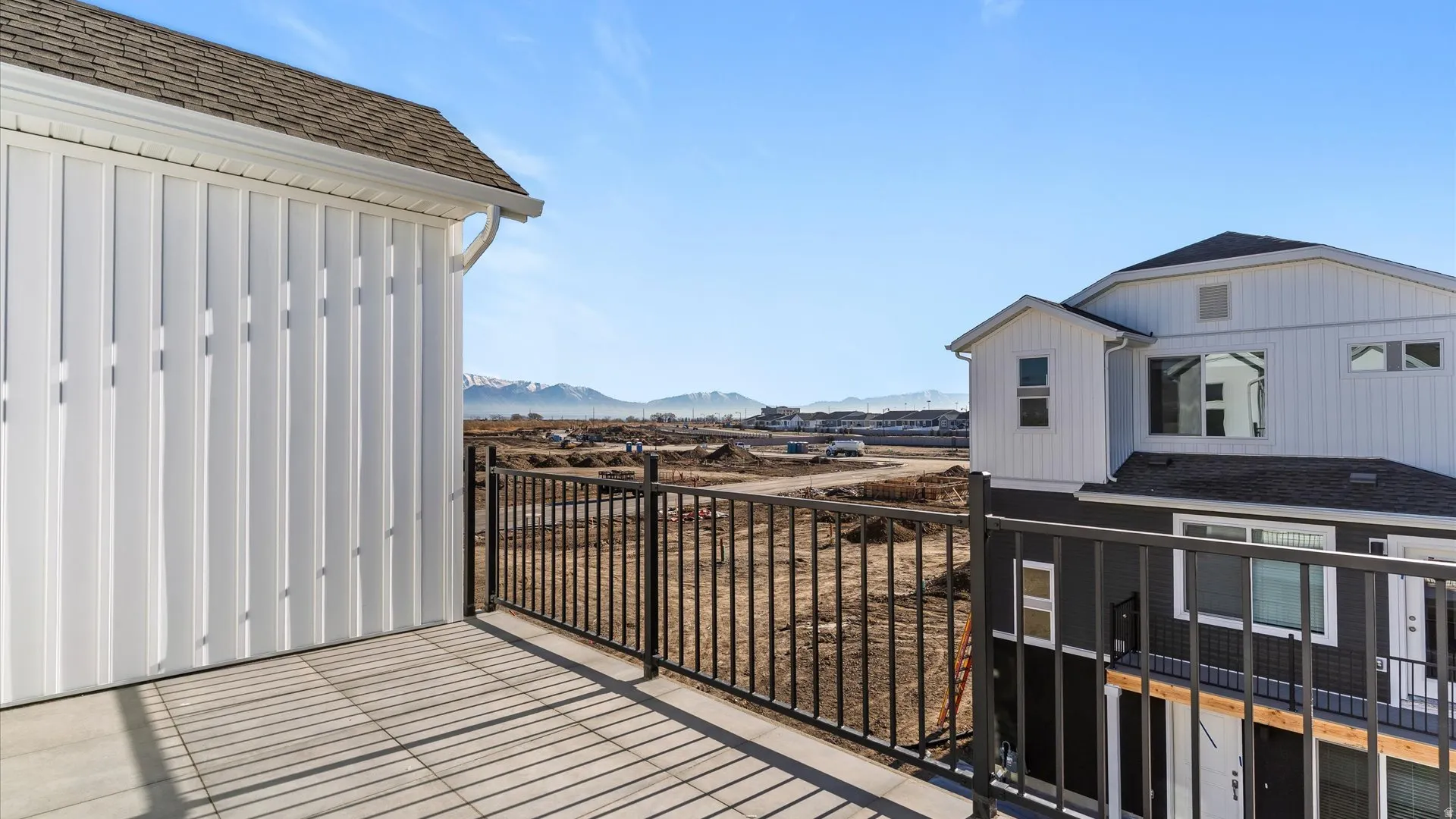 Outdoor balcony with black metal railing