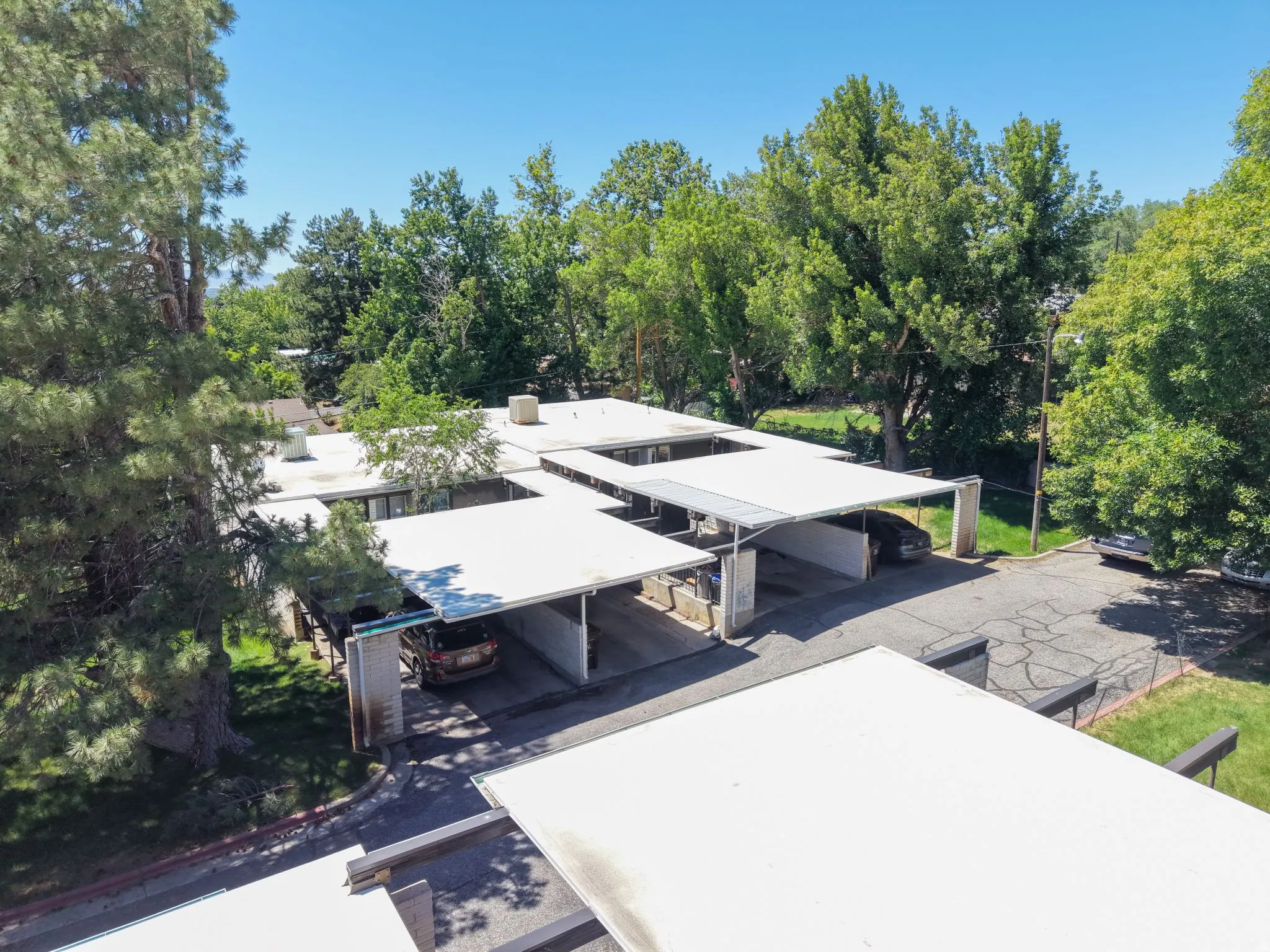 Multiple covered parking spaces with additional open lot parking